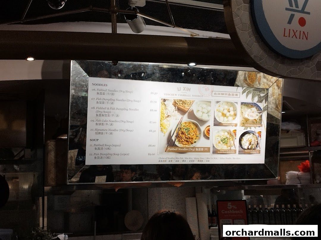 A menu board for Li Xin Teochew Fishball Noodles with various noodle and soup options.