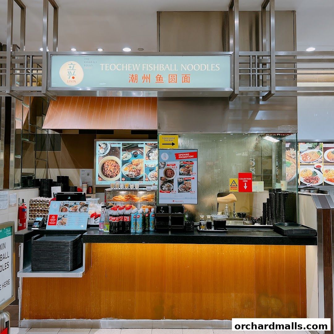 The storefront of LiXin Teochew Fishball Noodles, featuring a menu display and counter.