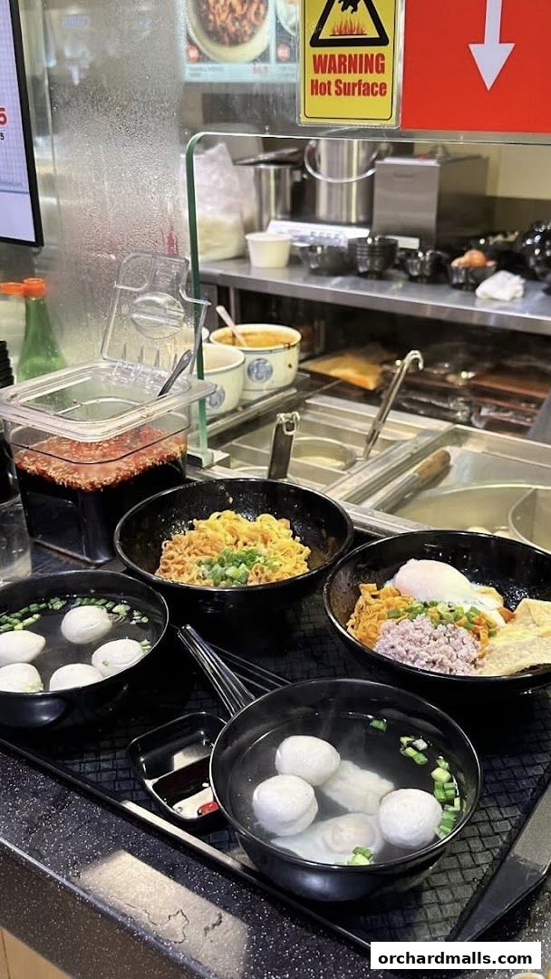 Bowls of Teochew fishball noodles and soup are ready to be served.