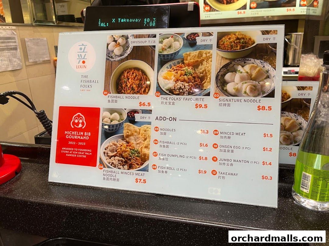 A menu board for LiXin Teochew Fishball Noodles, featuring popular dishes and add-ons.