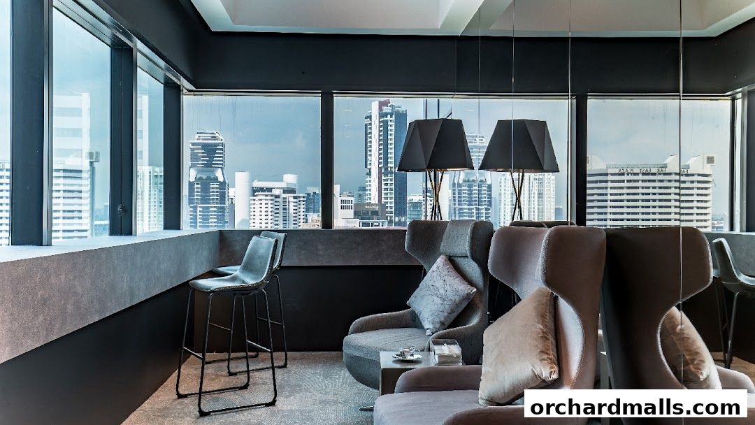Modern lounge area with comfortable seating and city skyline views.