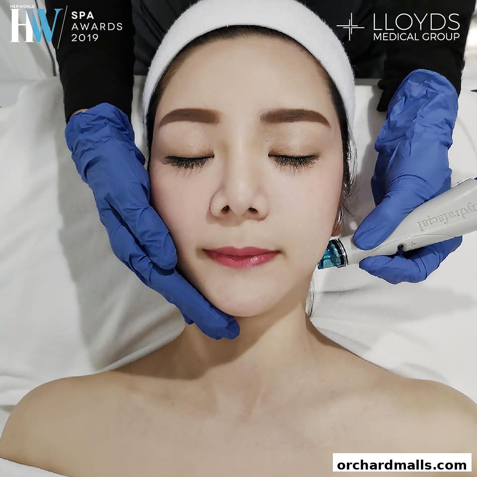 A woman receives a facial treatment with a HydraFacial device at Lloyds Medical Group.