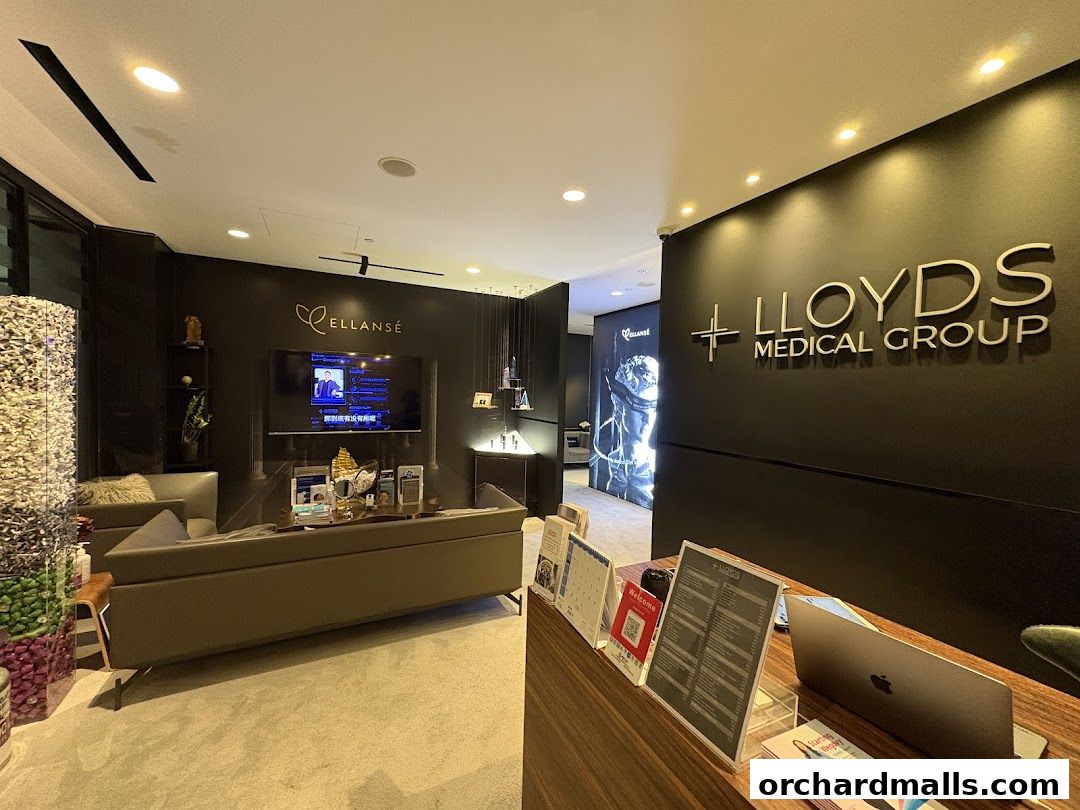 Interior of Lloyds Medical Group with a reception desk, seating area, and branding.