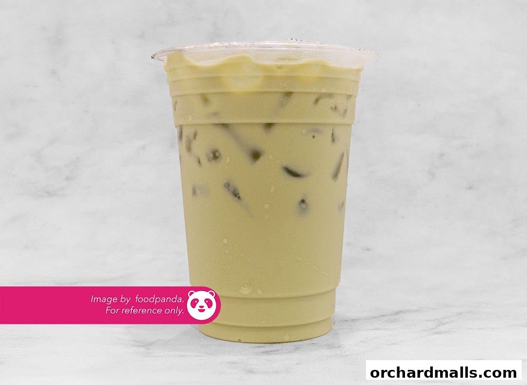 A refreshing iced matcha latte with ice cubes in a clear plastic cup.