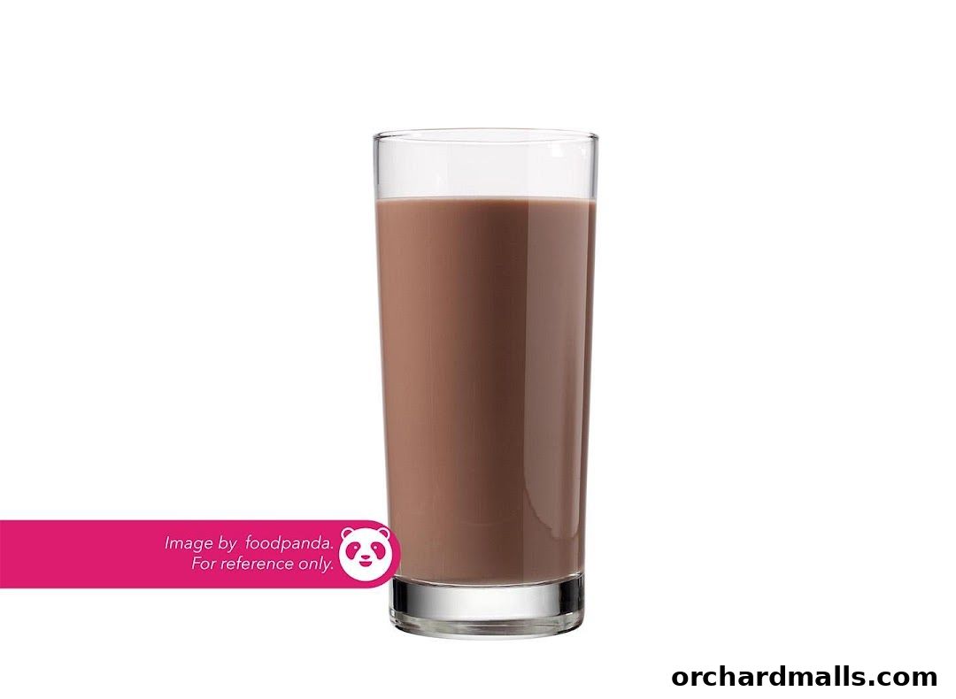 A tall glass filled with chocolate milk, presented against a white background.