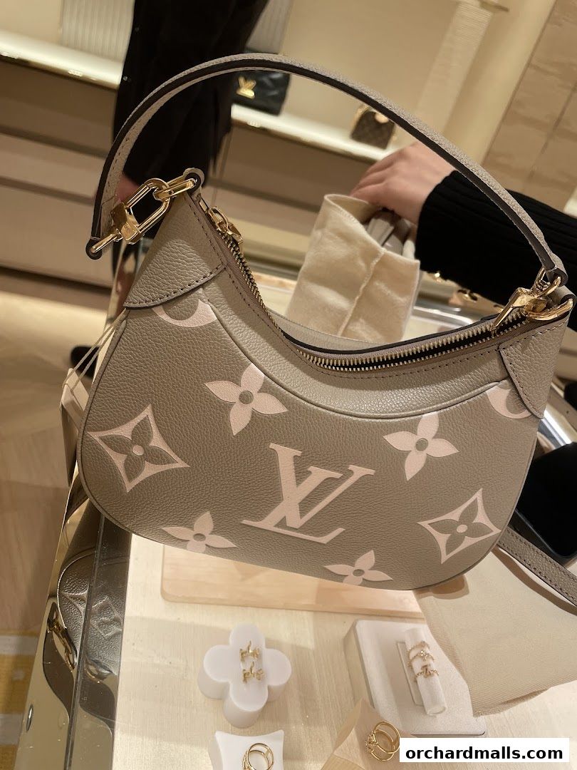A close-up of a Louis Vuitton handbag with the iconic monogram pattern.