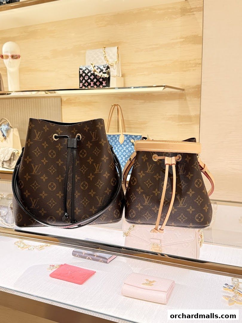 Interior shot of Louis Vuitton store showcasing iconic monogrammed bucket bags and accessories.
