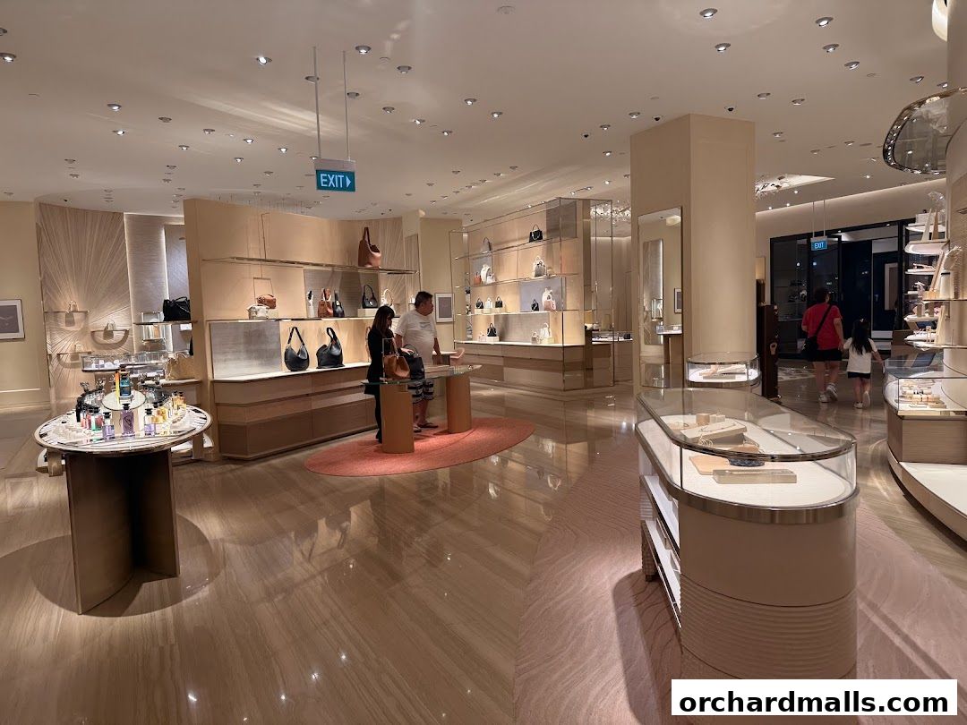 Interior view of a luxurious Louis Vuitton store showcasing handbags and accessories.