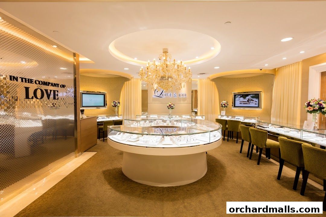 Interior of a luxurious jewelry store featuring display cases filled with rings and a large chandelier.