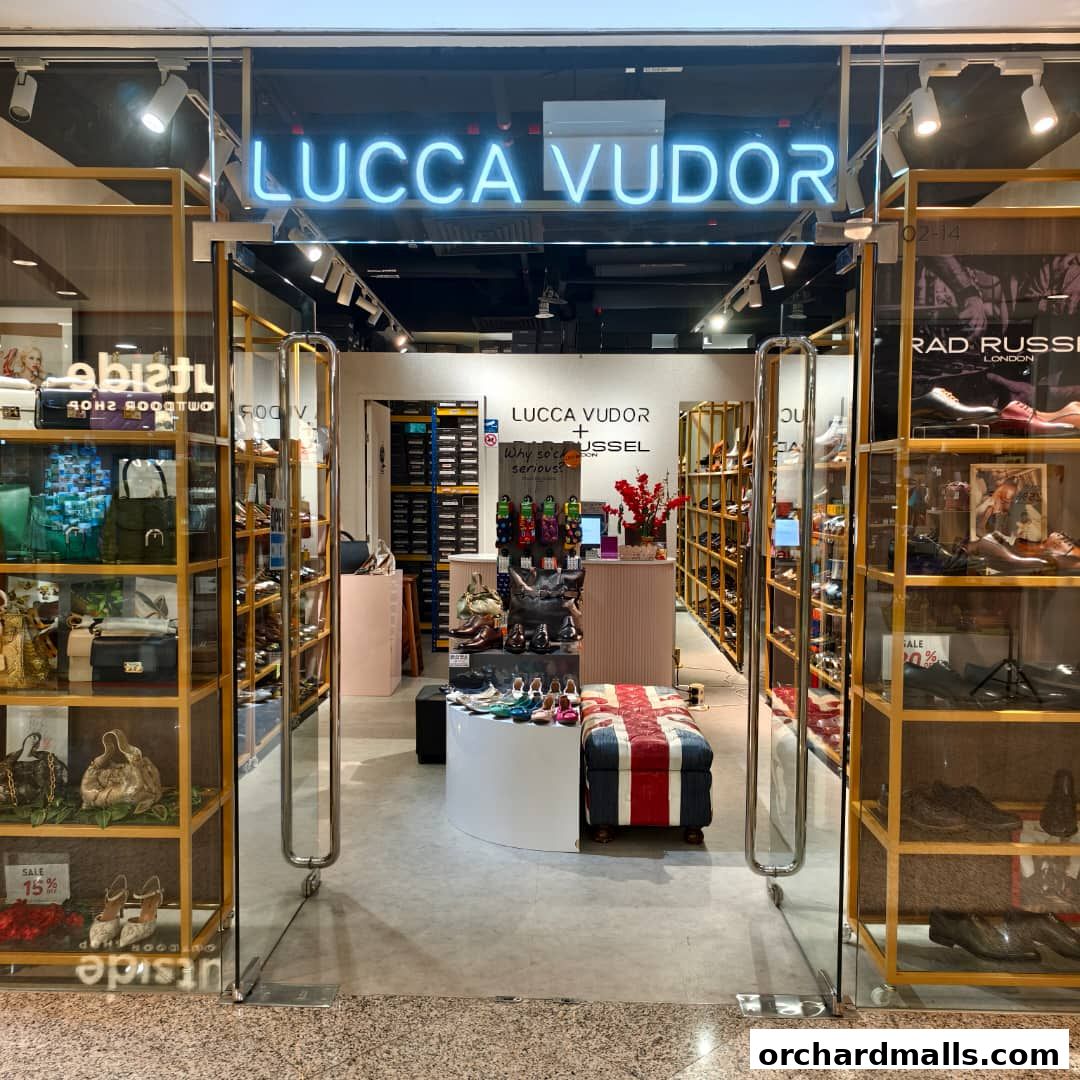 The entrance of Lucca Vudor, a shoe and bag store, showcasing stylish footwear and accessories.