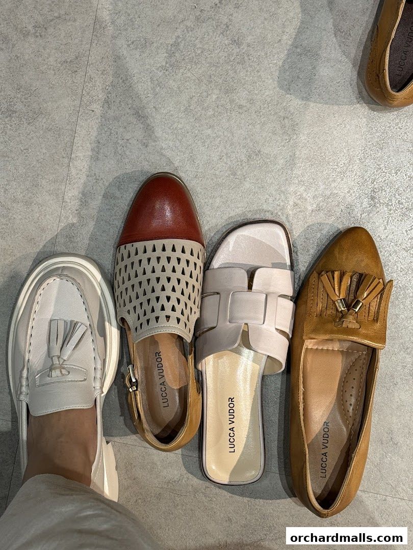A selection of stylish women's shoes from Lucca Vudor, including loafers and sandals.