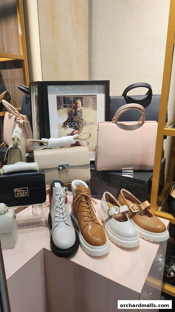 A display of stylish handbags and footwear from Lucca Vudor Rad Russel.