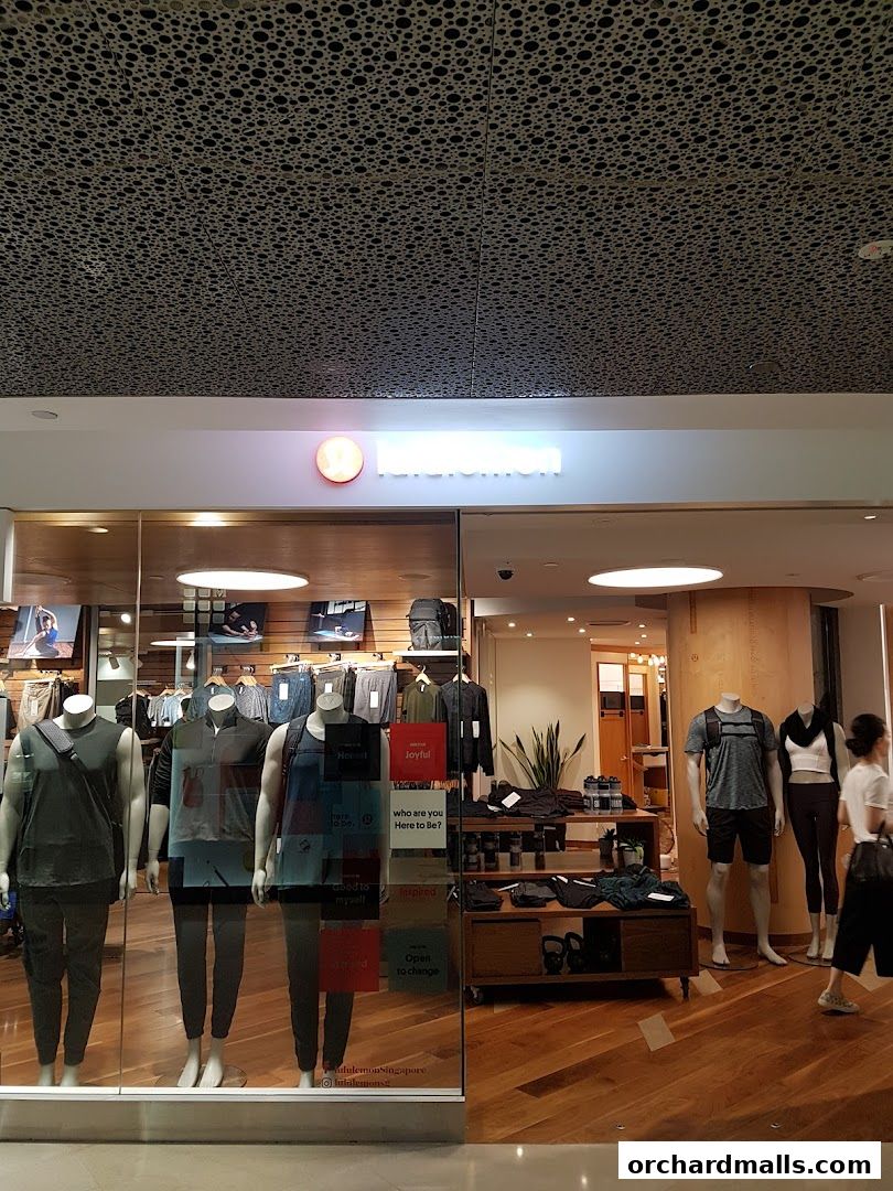 The Lululemon store features mannequins in athletic wear and inspirational quotes in its window display.