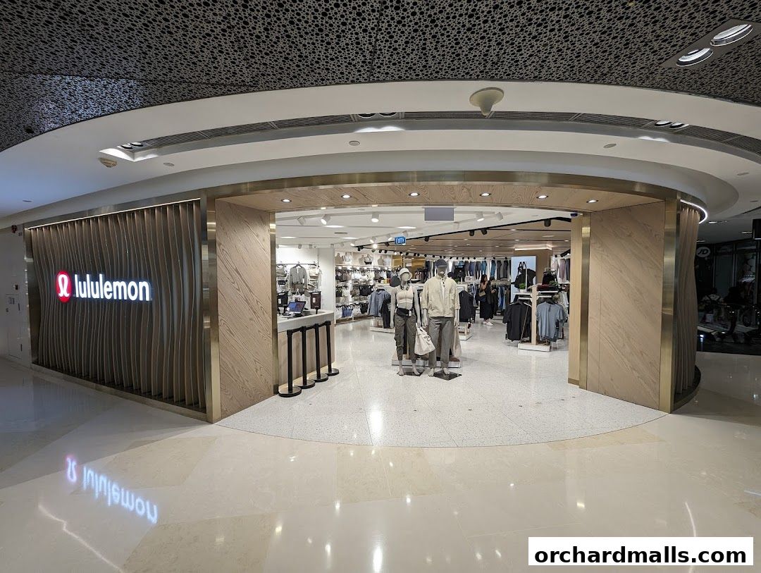 The entrance of a Lululemon store with mannequins displaying athletic wear.