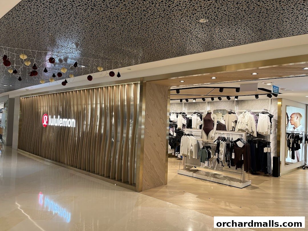 The lululemon store entrance with its distinctive logo and display of athletic apparel.