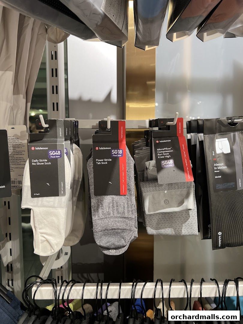 A display of various lululemon socks and underwear, including no-show, tab, and knee-high styles.