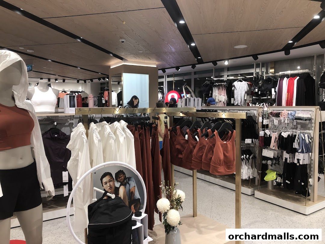 Interior view of a Lululemon store showcasing athletic apparel on mannequins and racks.