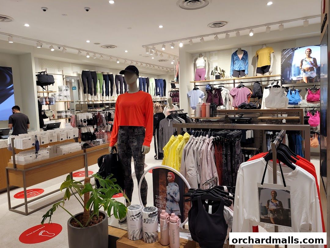 Interior view of a Lululemon store showcasing athletic apparel and accessories on display.