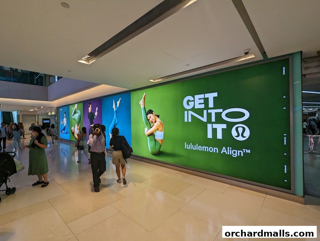 A large Lululemon advertisement featuring yoga poses and the slogan 'GET INTO IT'.
