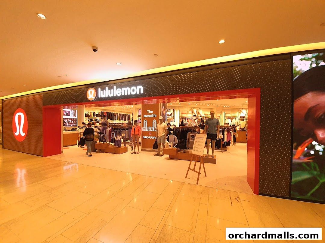 The entrance of a Lululemon store showcasing athletic apparel and mannequins.
