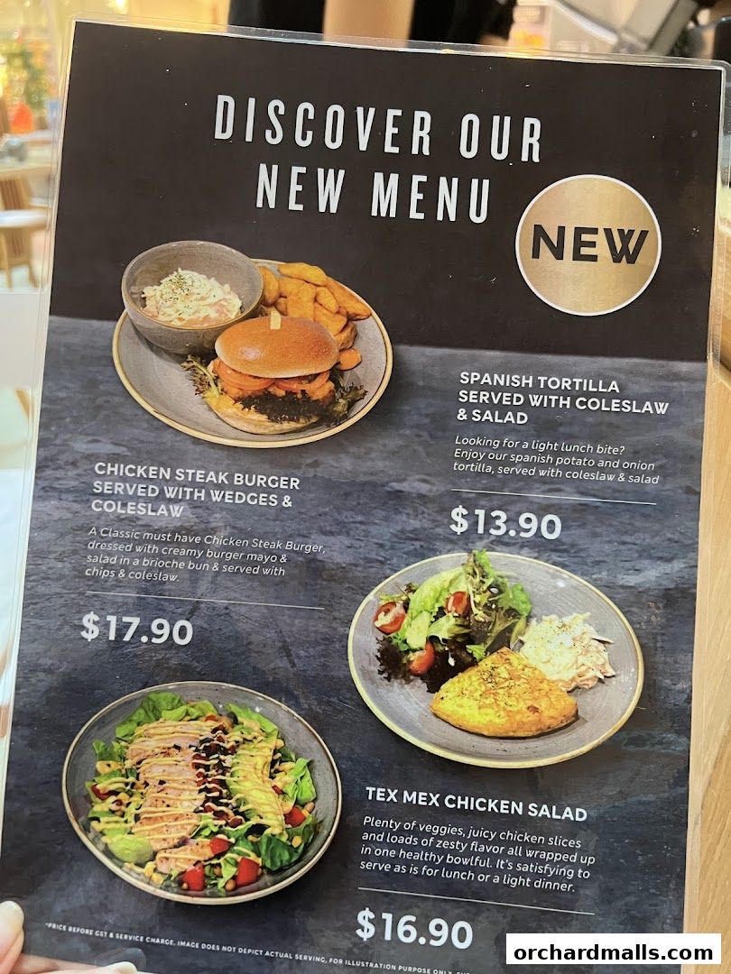 A menu showcasing new dishes from MS Café, featuring burgers, tortillas, and salads.