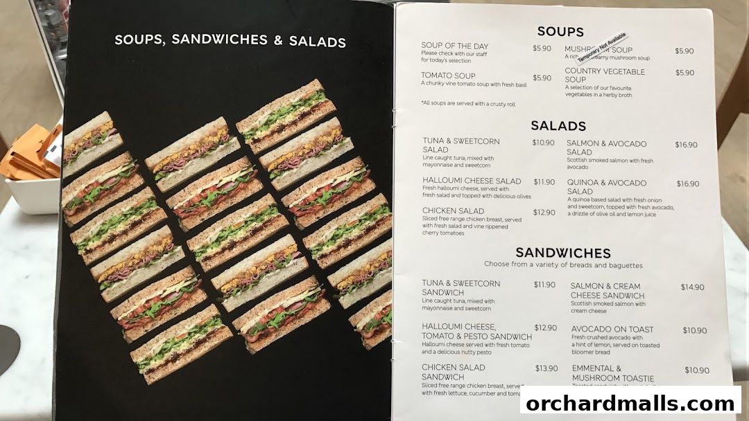 A menu displaying soups, salads, and sandwiches with prices and descriptions.