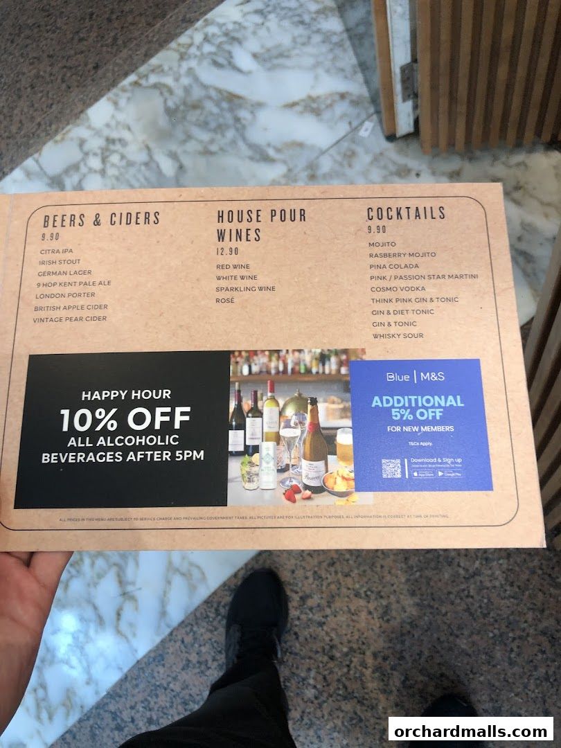 A menu from MS Cafe featuring beers, ciders, wines, and cocktails with a happy hour offer.