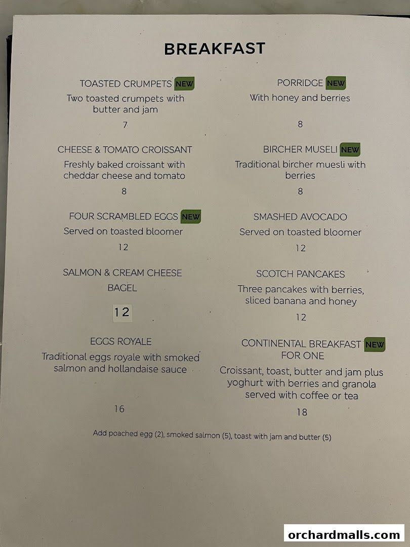 A breakfast menu from MS Café with various dishes and prices.
