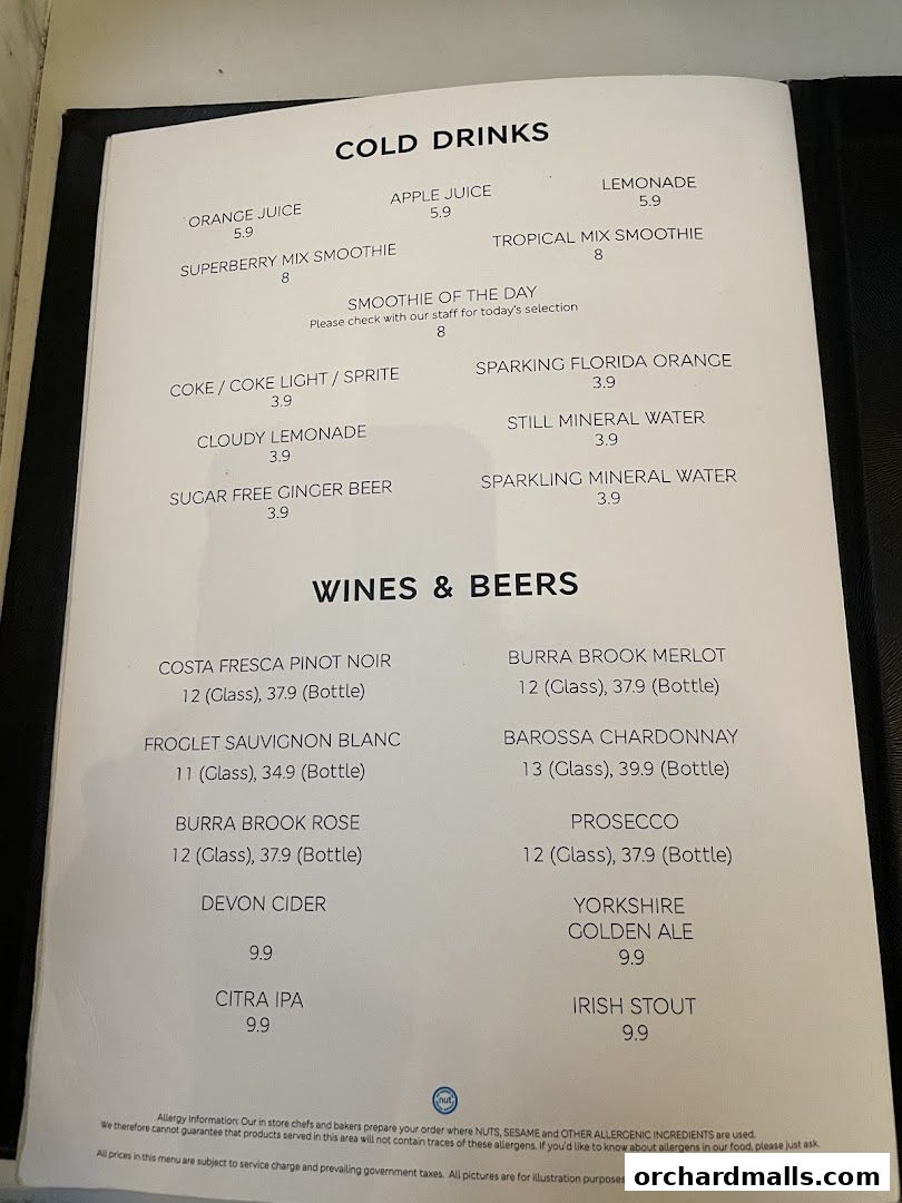 A menu from MS Café featuring cold drinks, wines, and beers with prices.