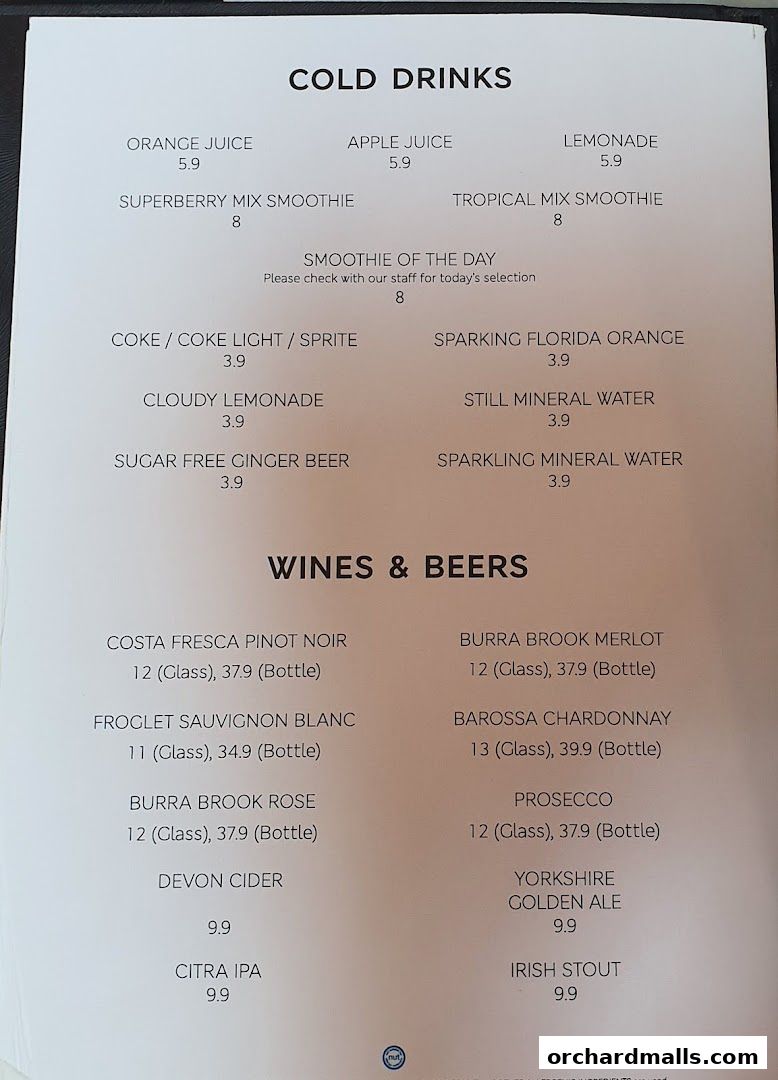 A menu from MS Café featuring cold drinks, wines, and beers with prices.