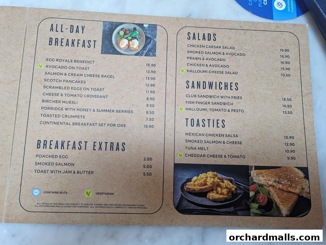 A menu from MS Café featuring breakfast, salads, sandwiches, and toasties with prices.
