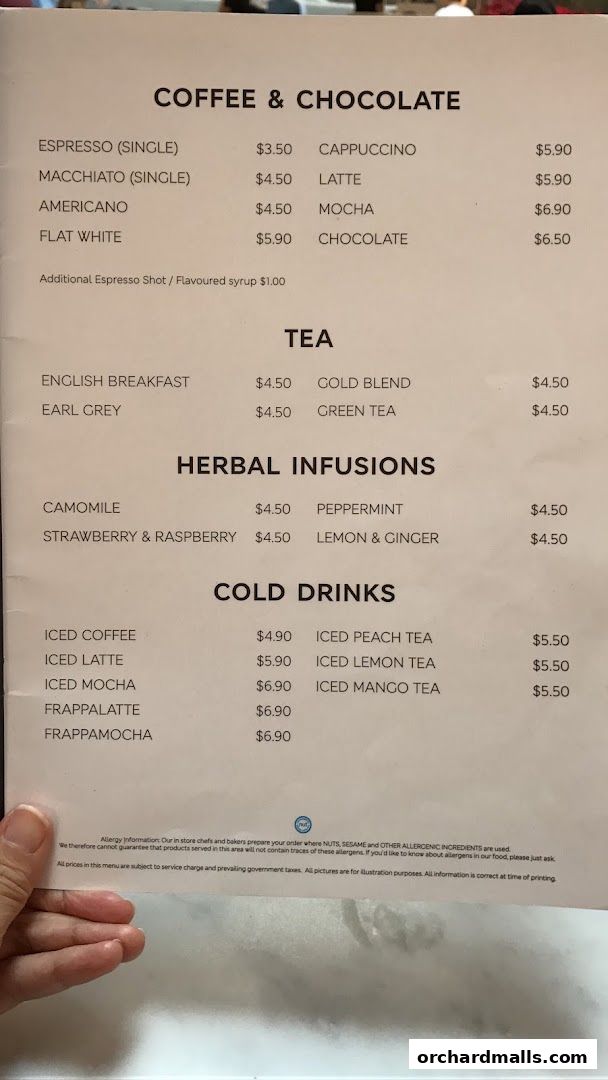 A menu from MS Café featuring coffee, tea, herbal infusions, and cold drinks with prices.