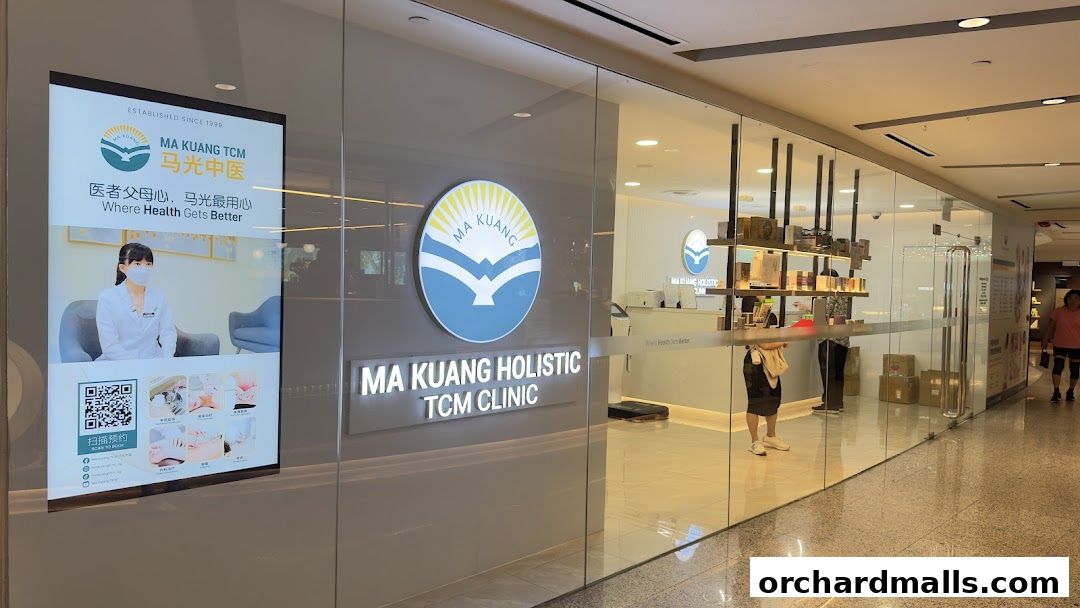 Exterior view of Ma Kuang Holistic TCM Clinic with signage and display screen.