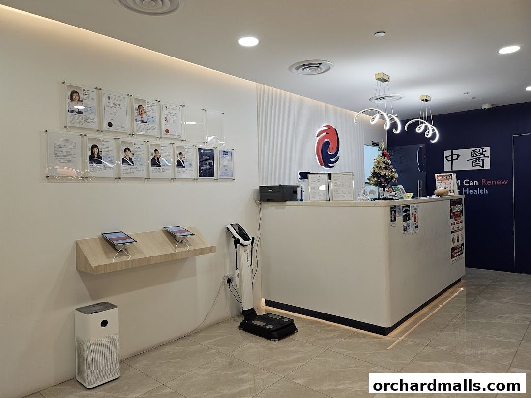 Reception area of a Traditional Chinese Medicine clinic with certificates on the wall.