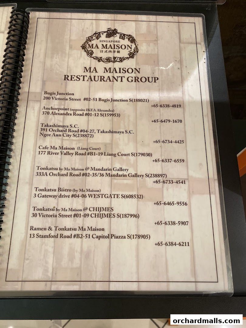 A menu listing the locations and contact numbers for Ma Maison Restaurant Group.