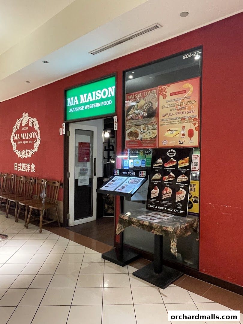 The entrance of Ma Maison, a Japanese Western Food restaurant, with menus and posters displayed.