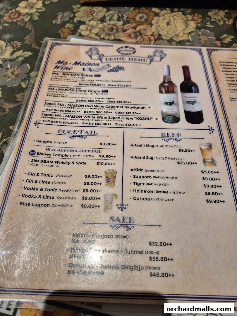 A drink menu from Ma Maison featuring wines, cocktails, beers, and sake.