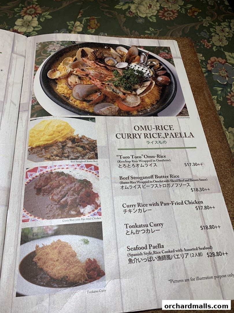 A menu page from Ma Maison featuring Omu-Rice, Curry Rice, and Paella dishes.