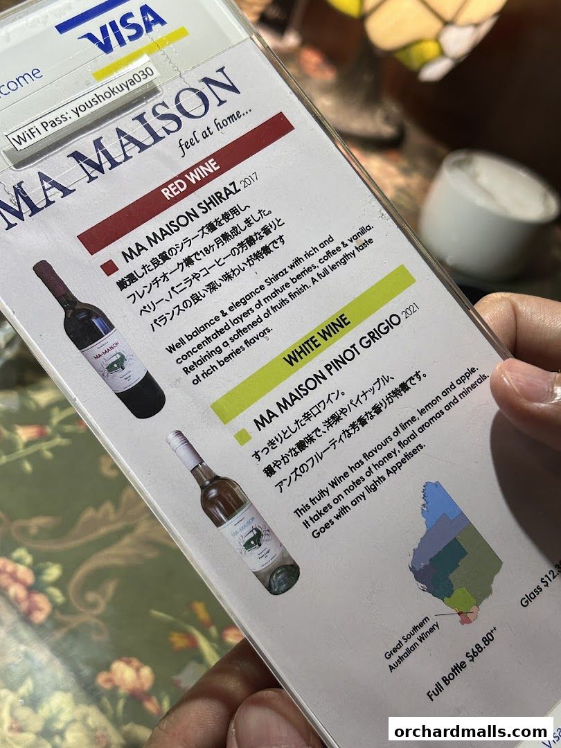 A menu card for Ma Maison restaurant featuring red and white wines.