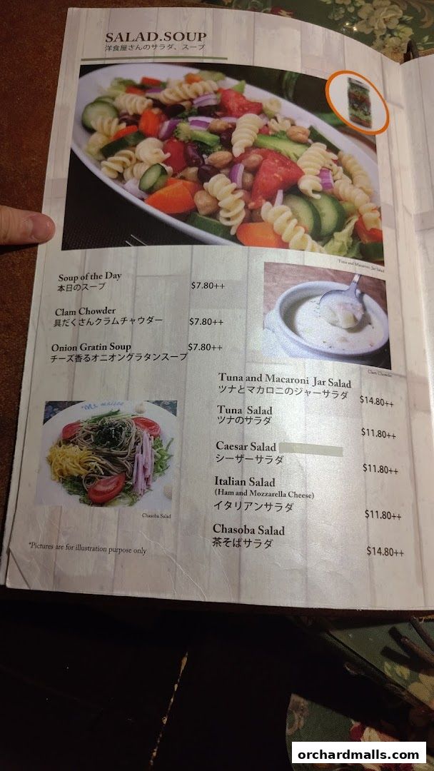 A menu page from Ma Maison featuring salads and soups with prices and images.