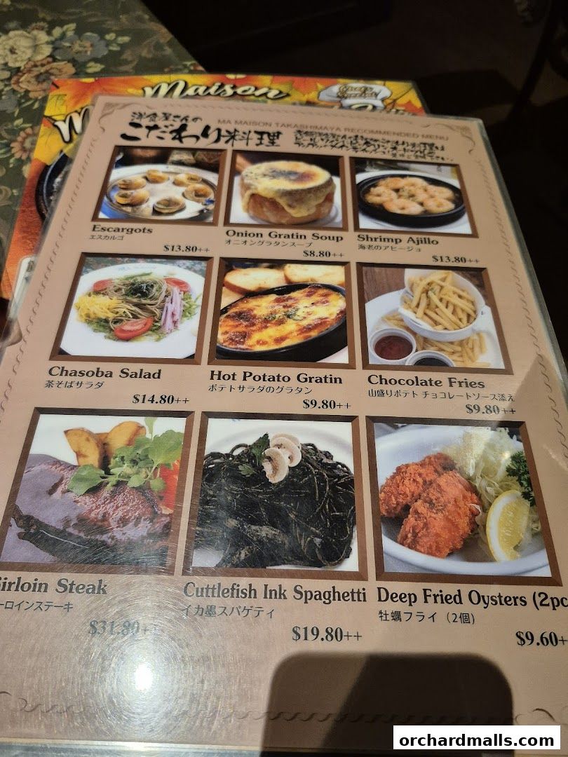 A menu from Ma Maison restaurant featuring various dishes with images and prices.