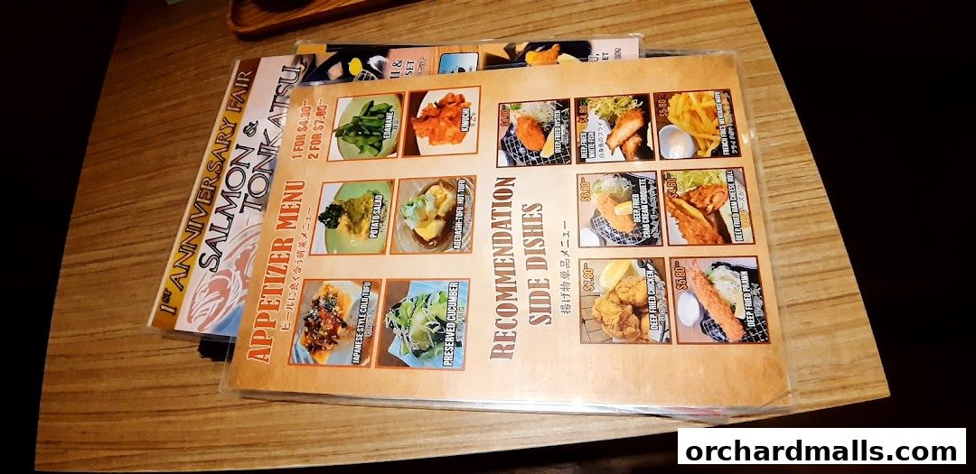 A menu from Ma Maison featuring appetizers and recommended side dishes with images.