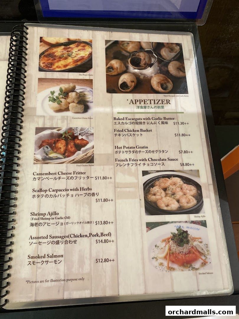 A menu page from Ma Maison featuring appetizers like escargots, fried chicken, and smoked salmon.