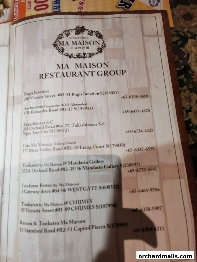 A menu from Ma Maison Restaurant Group listing various locations and contact numbers.