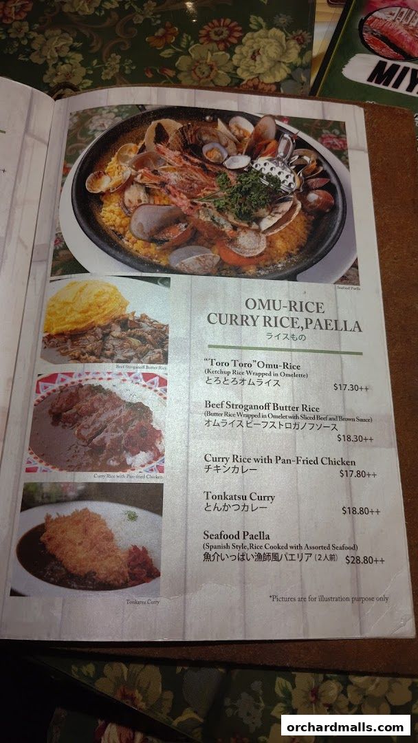 A menu page from Ma Maison featuring Omu-Rice, Curry Rice, and Paella dishes.