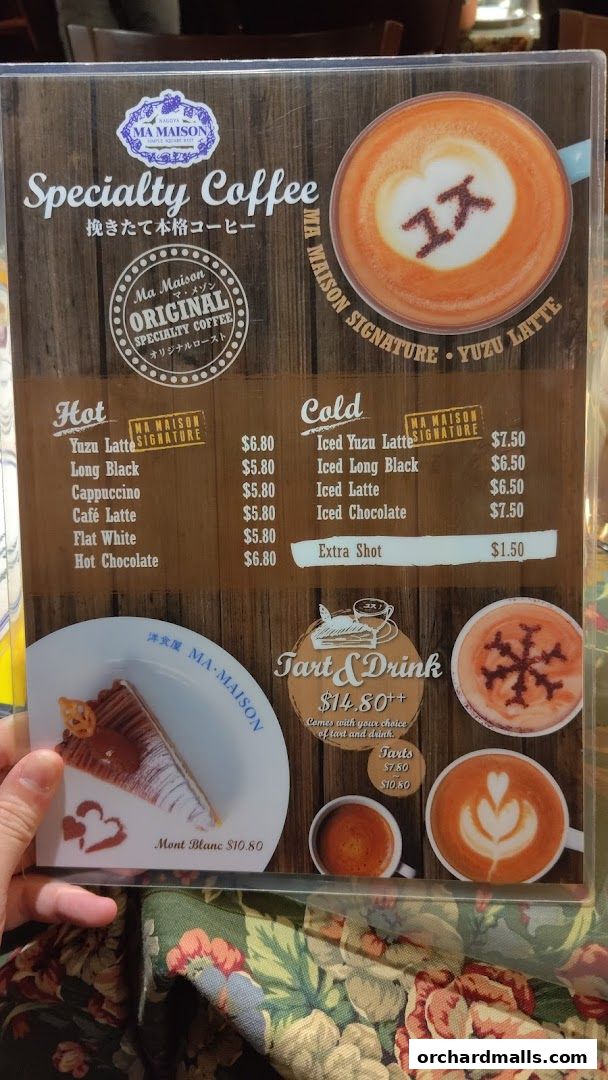A menu from Ma Maison featuring specialty coffees, tarts, and drinks with prices.
