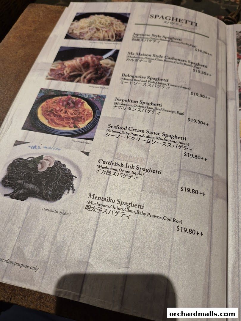 A menu page from Ma Maison featuring various spaghetti dishes with images and prices.
