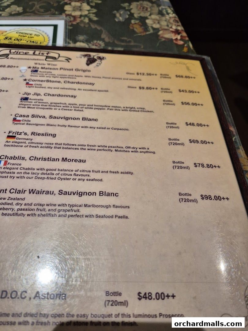 A wine list menu from Ma Maison featuring various white wines with descriptions and prices.