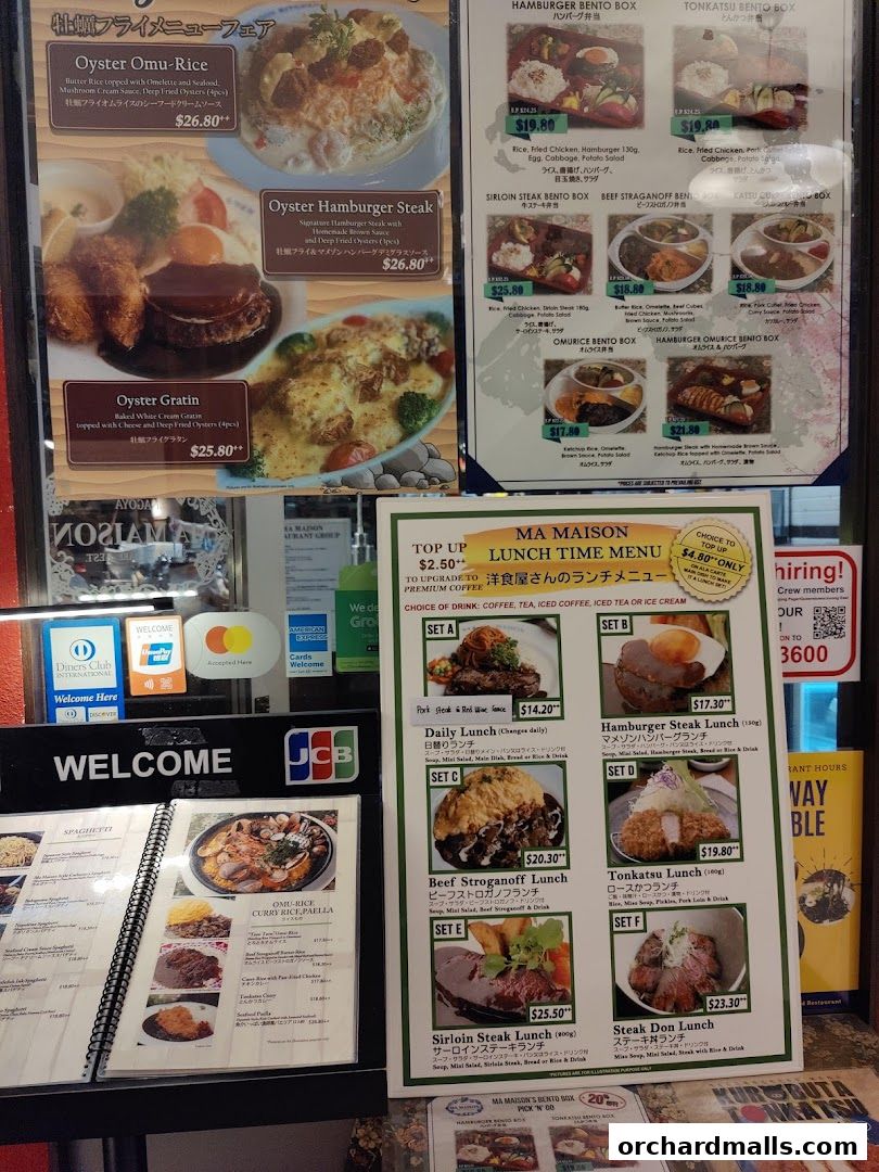 A display of Ma Maison's lunch menu featuring various bento boxes and set meals.