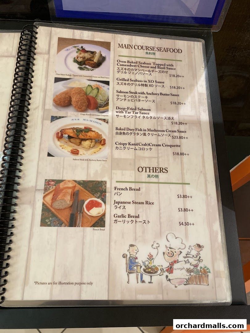 A menu from Ma Maison restaurant featuring seafood main courses and other items.